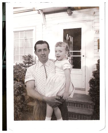 1962 - Robert, with one of those bolo ties, daughter Wendy, at the original house at 29520 Sylvan Drive, Willowick.jpg